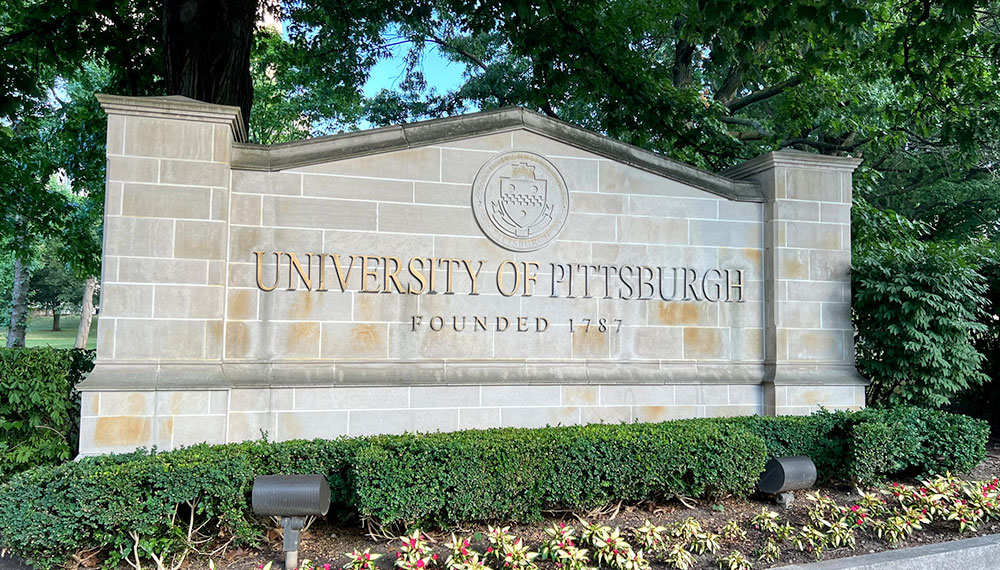 University of Pittsburgh sign on stone wall